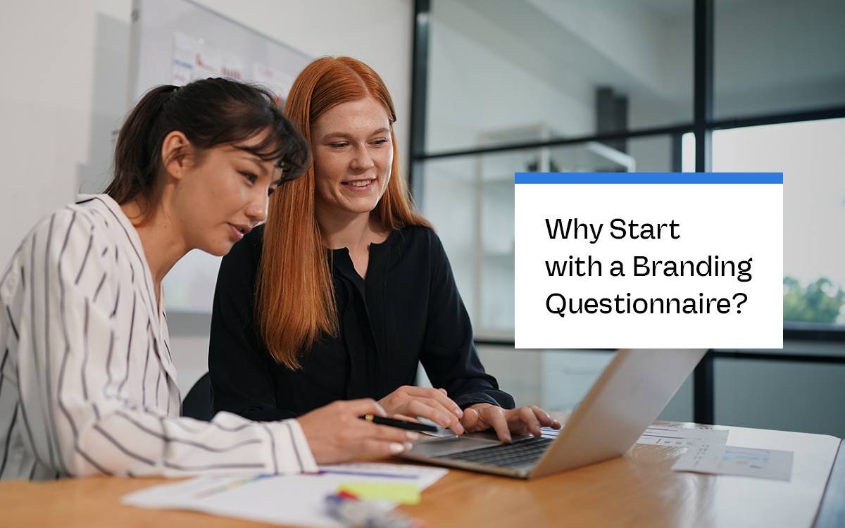 Two women collaborating at a desk with a laptop, focusing on branding strategy. The text on the right reads, 'Why Start with a Branding Questionnaire?'